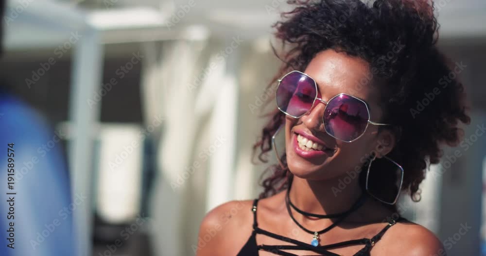 Young beautiful woman wiht sunglasses stand talk with man on the street feel happy smiling laughing relax portrait close up sun city female lifestyle attractive caucasian cheerful slow motion Young beautiful woman wiht sunglasses stand talk with man on the street feel happy smiling laughing relax portrait close up sun city female lifestyle attractive caucasian cheerful slow motion