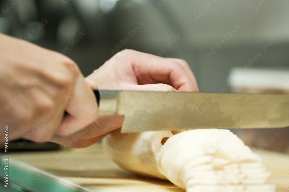 Chef training cut vegetable on cutting board with knife japan Chef training cut vegetable on cutting board with knife japan