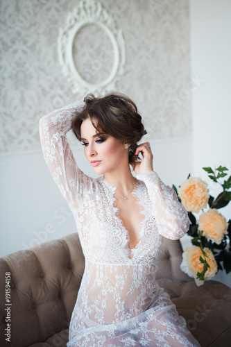 beautiful sensual woman in white lace dress
