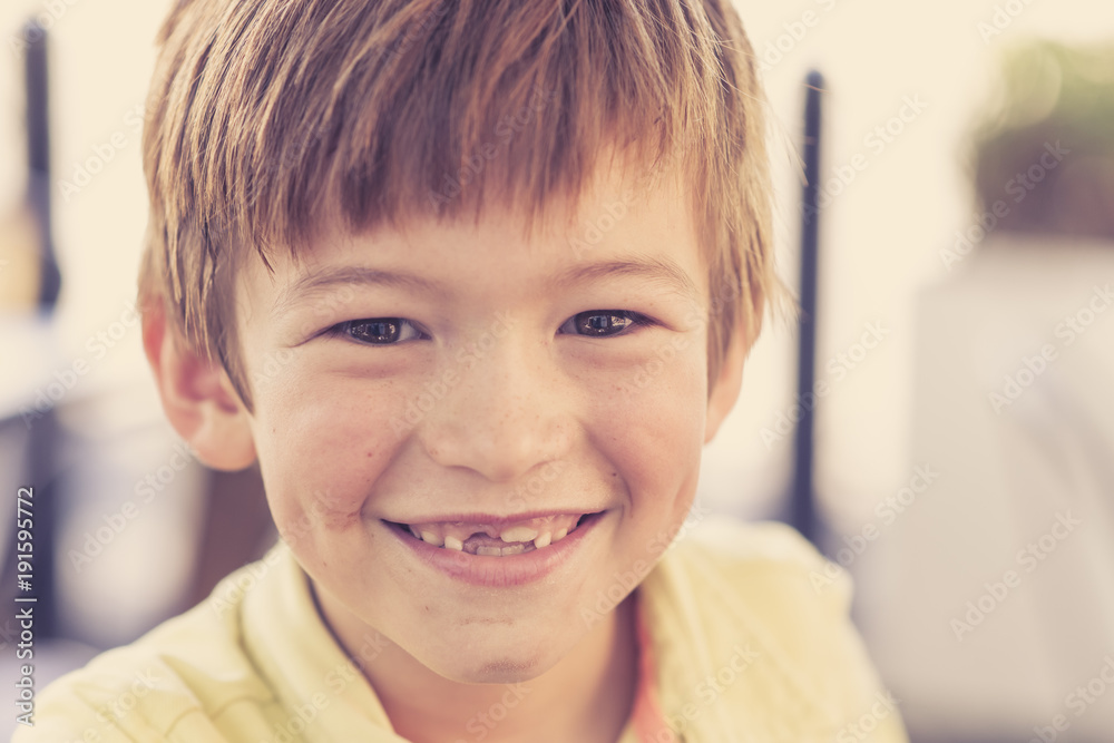 close up headshot portrait of young little 7 or 8 years old boy with sweet funny teeth smiling happy and cheerful in joy face expression close up headshot portrait of young little 7 or 8 years old boy with sweet funny teeth smiling happy and cheerful in joy face expression