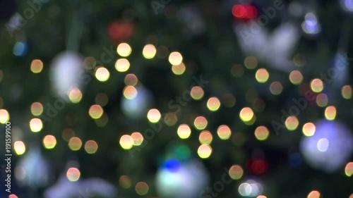 Flashing snowflake Rasfokus on background of Christmas tree photo