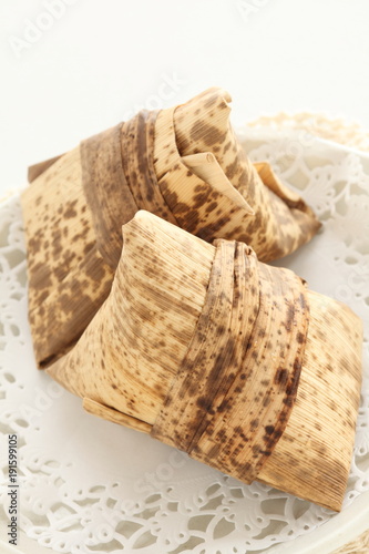 Chinese food, steamed sticy rice dumpling in leaf photo