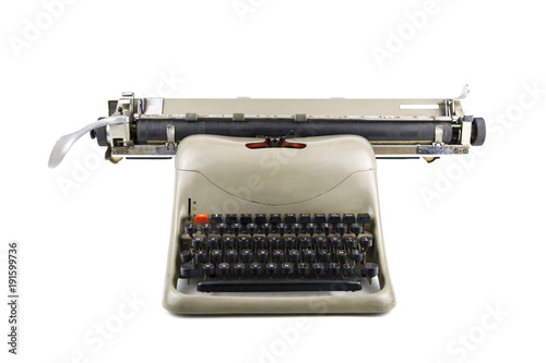 isolated portrait of an old typewriter / front view of a vintage typewriter isolated in white background