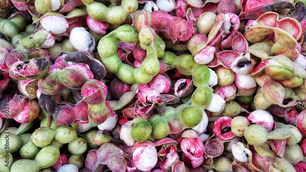 Manila tamarind has a pink and green shell with a bitter taste ...