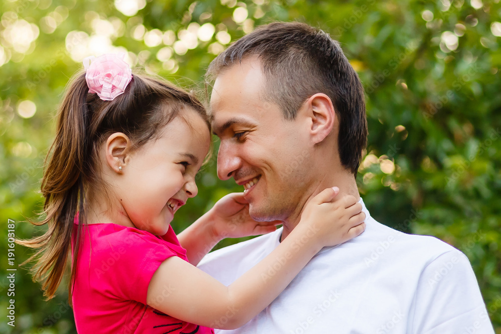 Portrait of little girl hugging her daddy Portrait of little girl hugging her daddy
