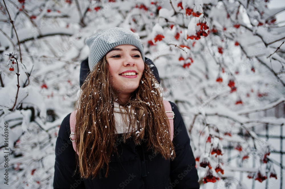 Portrait of girl at winter snowy day near snow covered trees. Portrait of girl at winter snowy day near snow covered trees.