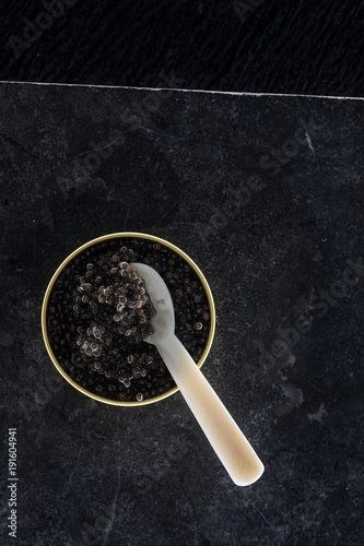 Caviar on a black marble table photo