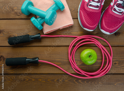  sneakers bottle of water apple and skipping rope
