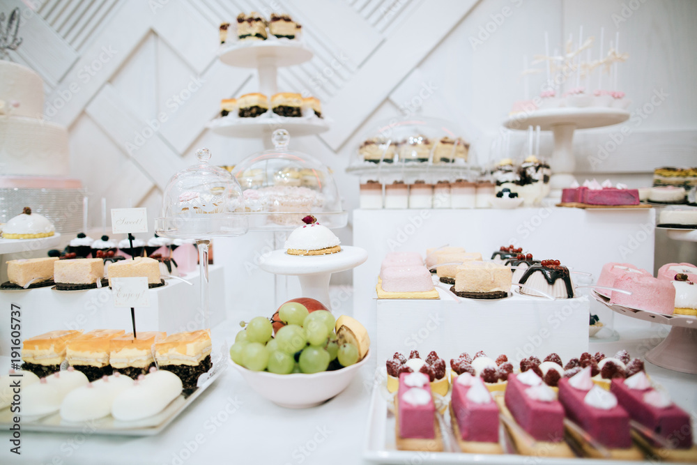 luxury wedding catering, candt bar with modern desserts, cupcakes, sweets with fruits