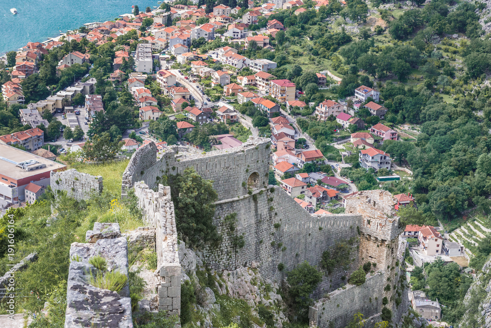 Obraz premium Aerial view from walls of St John Fortress in Kotor with Dobrota town on background, Montenegro