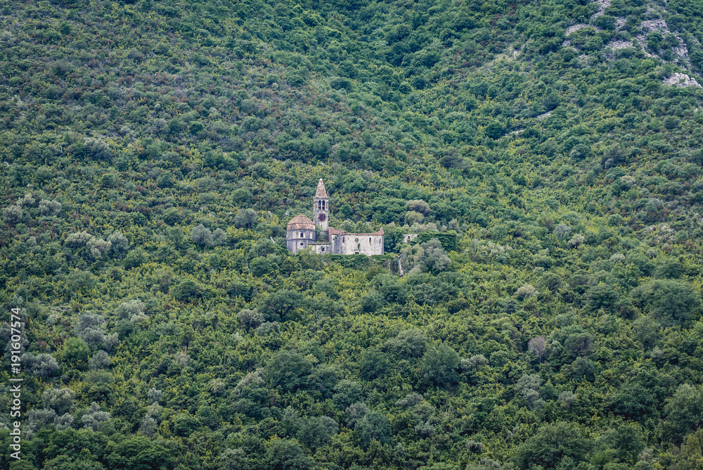Church ruins on a green slope above Prcanj village in the Kotor Bay, Montenegro