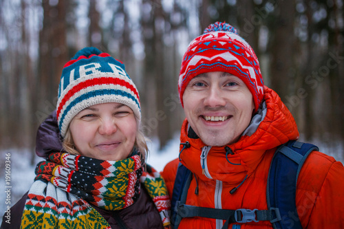 Image of happy couple on walk in winter forest