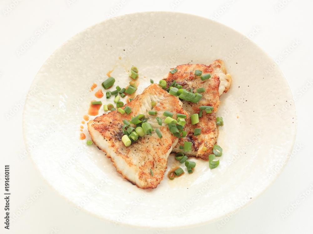 Chinese food, pan fried white fish and scallion
