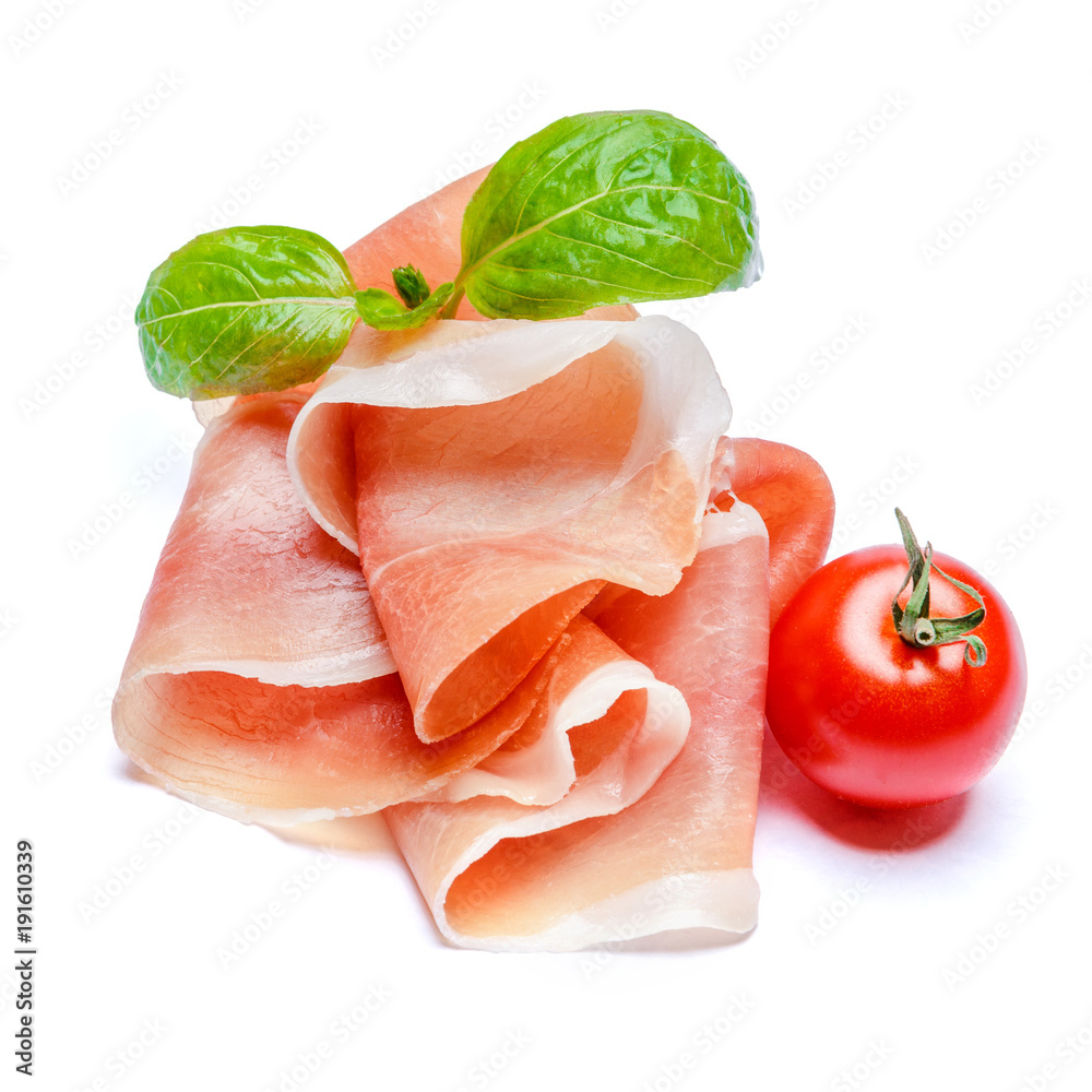Italian prosciutto crudo or spanish jamon and tomatoes. Raw ham