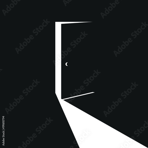 slightly open black door with white light photo