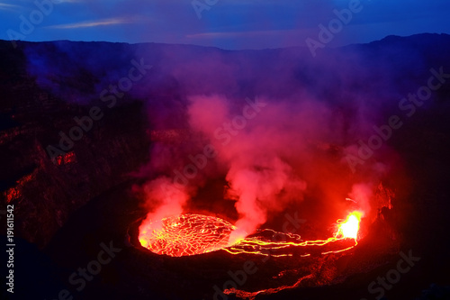 Lava and steam in crater of Nyiragongo volcano in Virunga National Park in Democratic Republic of Congo, Africa photo