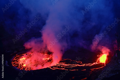 Lava and steam in crater of Nyiragongo volcano in Virunga National Park in Democratic Republic of Congo, Africa photo