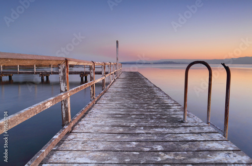 Whitewashed jetty at dusk