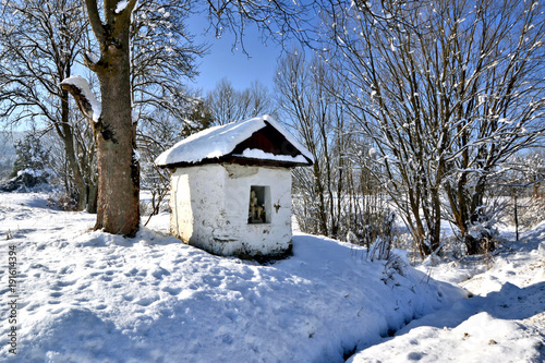 Wayside old small chapel in winter, Beskid Niski, Poland © Jurek Adamski