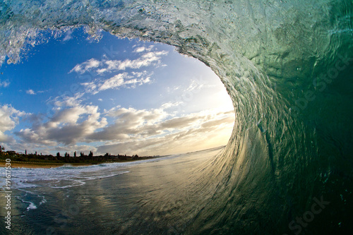 Sunrise view from inside a barreling wave