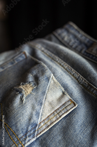 Details of blue jeans in zipper, pockets