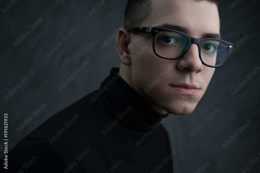 Fototapeta premium Portrait of young beautiful man in glasses