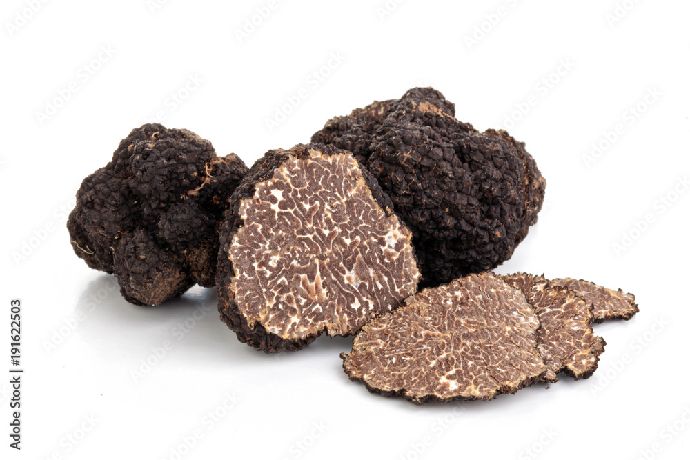 Black truffles and oak leaves. - obrazy, fototapety, plakaty 
