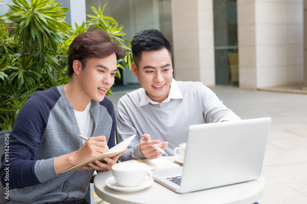 Asian Business people with casual suit working in coffee shop Asian Business people with casual suit working in coffee shop