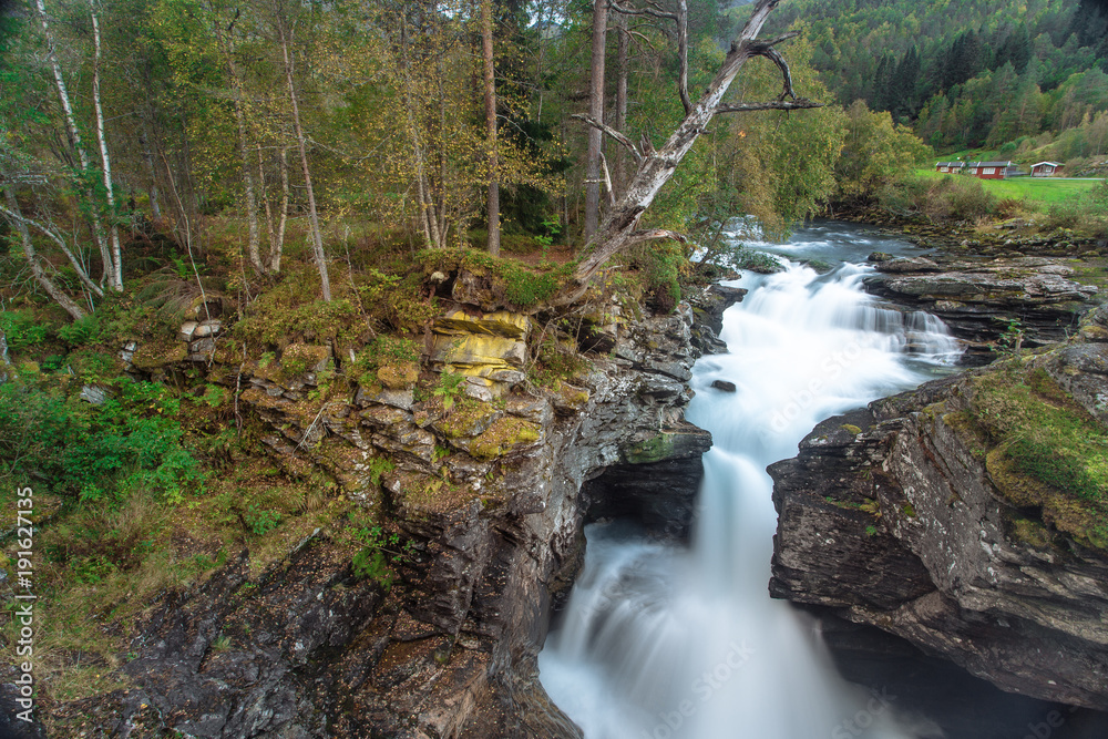 Waterfall  in forest in the norway