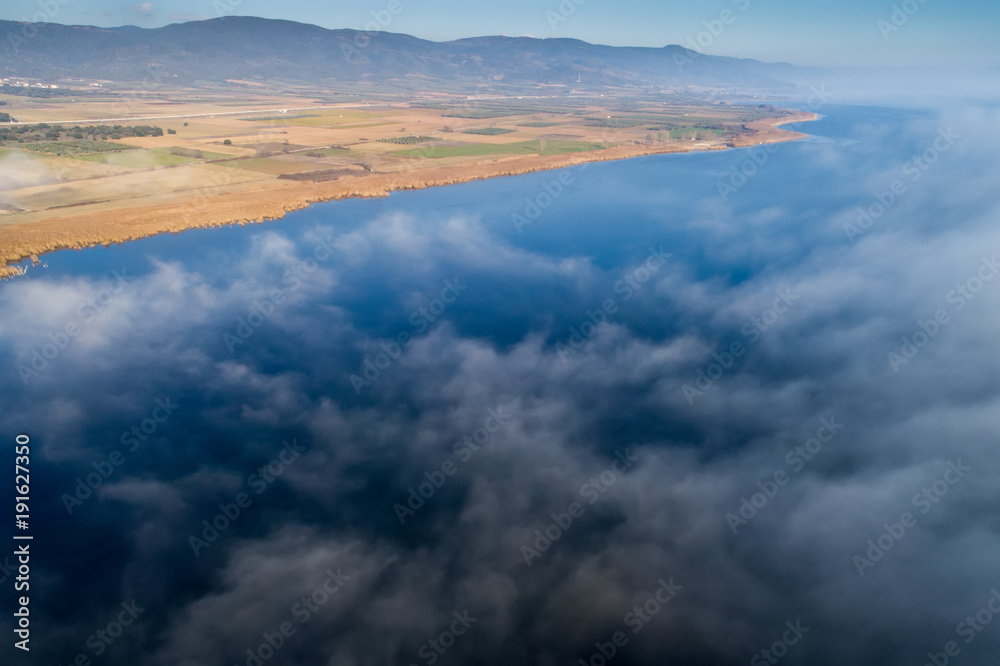 Obraz premium Aerial View. Flying over the clouds .
