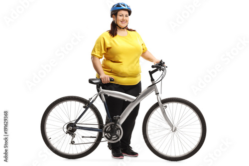 Overweight woman with a bicycle