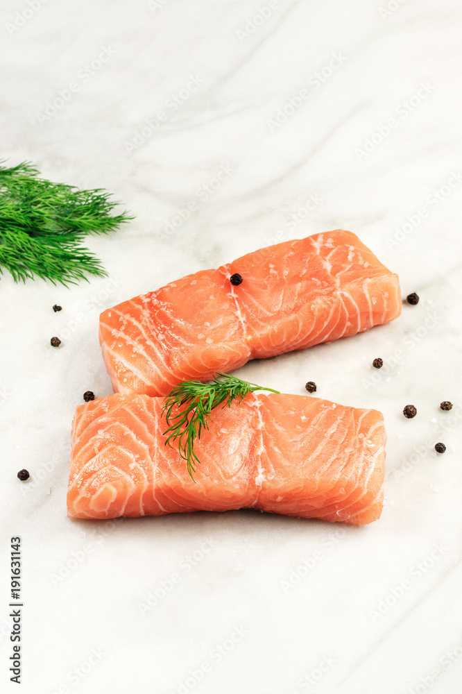 Slices of salmon with dill, peppercorns, and copyspace Slices of salmon with dill, peppercorns, and copyspace