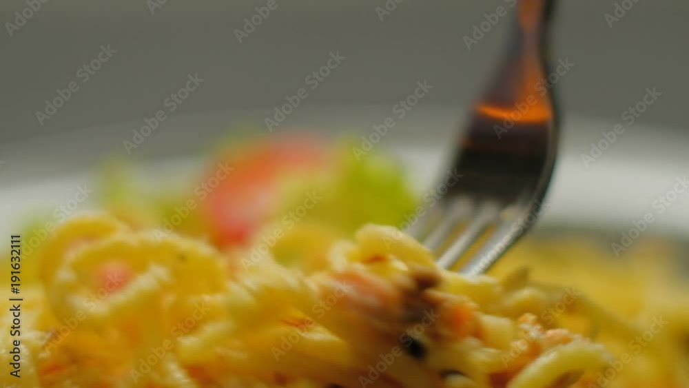traditional italian pasta recipe. homemade spaghetti on fork closeup