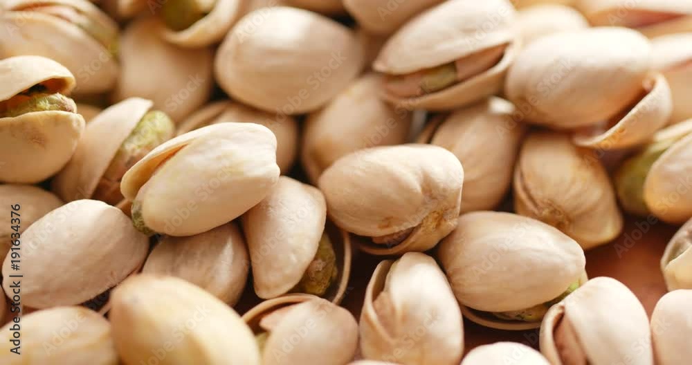 Stack of Roasted pistachios in rotation Stack of Roasted pistachios in rotation