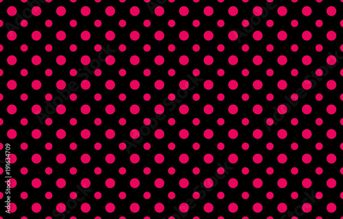 Fashionable pattern with two different sizes pink polka dots against a black background