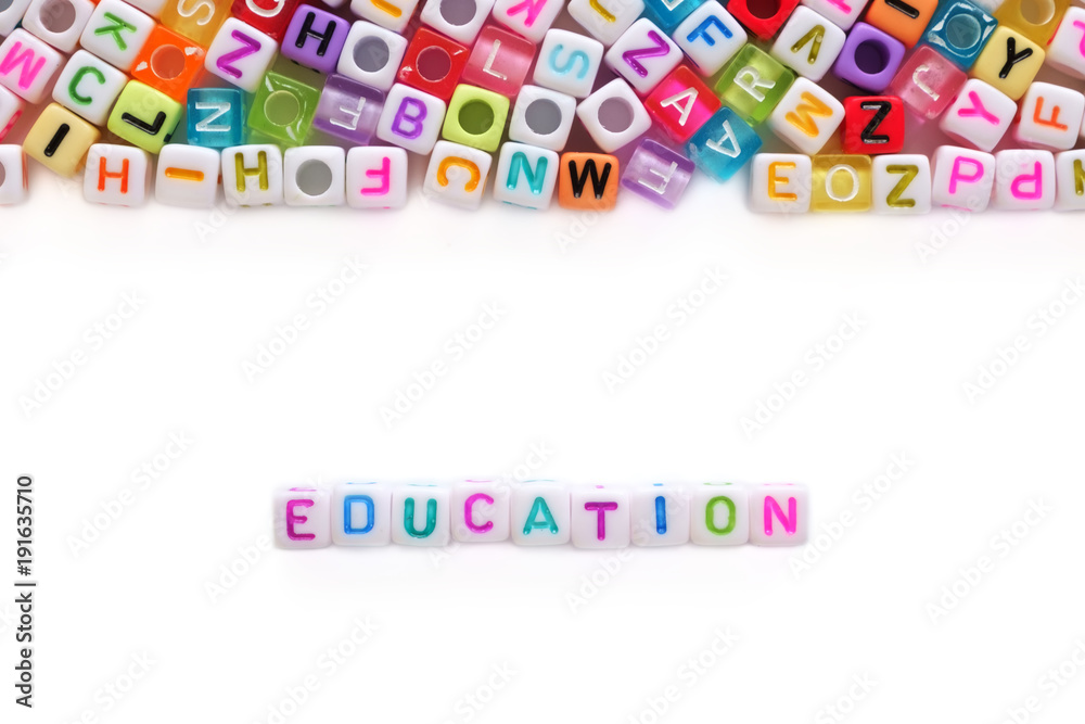 EDUCATION word and alphabet letter beads on white background for learning concept EDUCATION word and alphabet letter beads on white background for learning concept