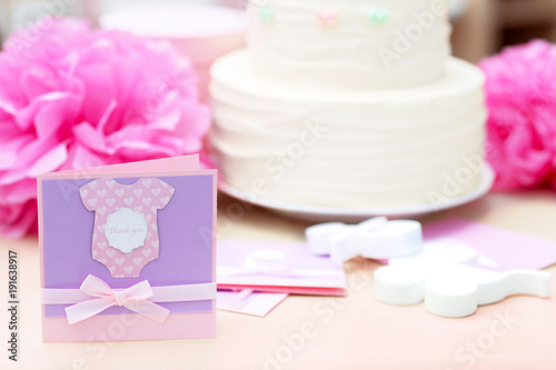 Thank you card for baby shower party on table