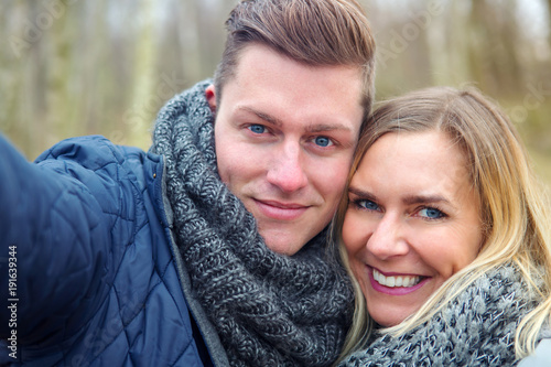 selfie of young couple outdoors in the cold