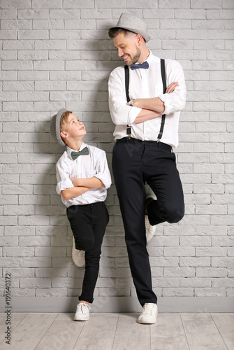Father and son in elegant s...