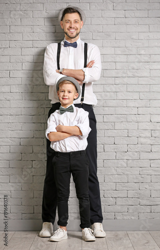 Father and son in elegant s...