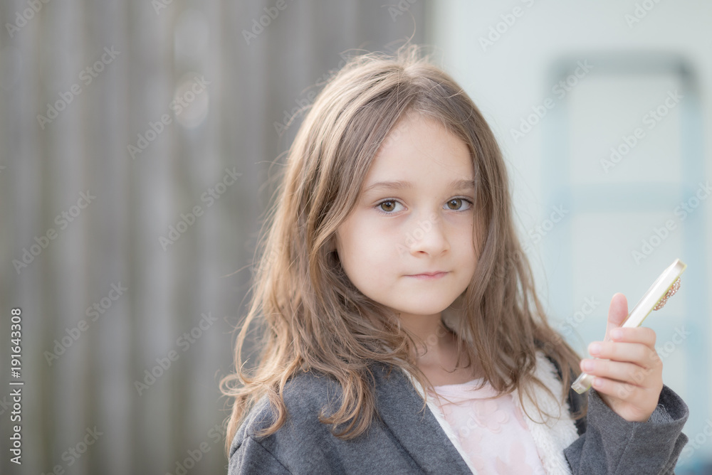 Cute blonde girl posing in an autumn sunny day Cute blonde girl posing in an autumn sunny day