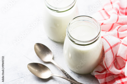 Greek yogurt in glass jars.