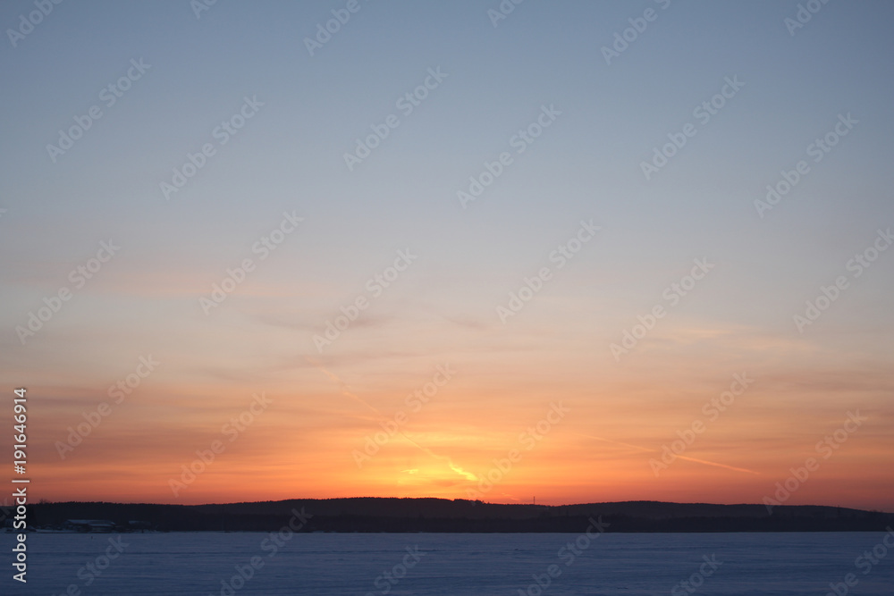 Winter and cold sunset