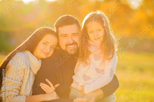 .Family playing in autumn park having fun