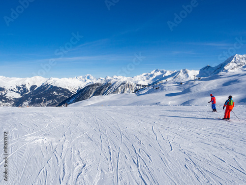 MERIBEL, FRANCE - JANUARY 2018: the white slopes in the Alps. Ski resort of Meribel, France. Sunny day