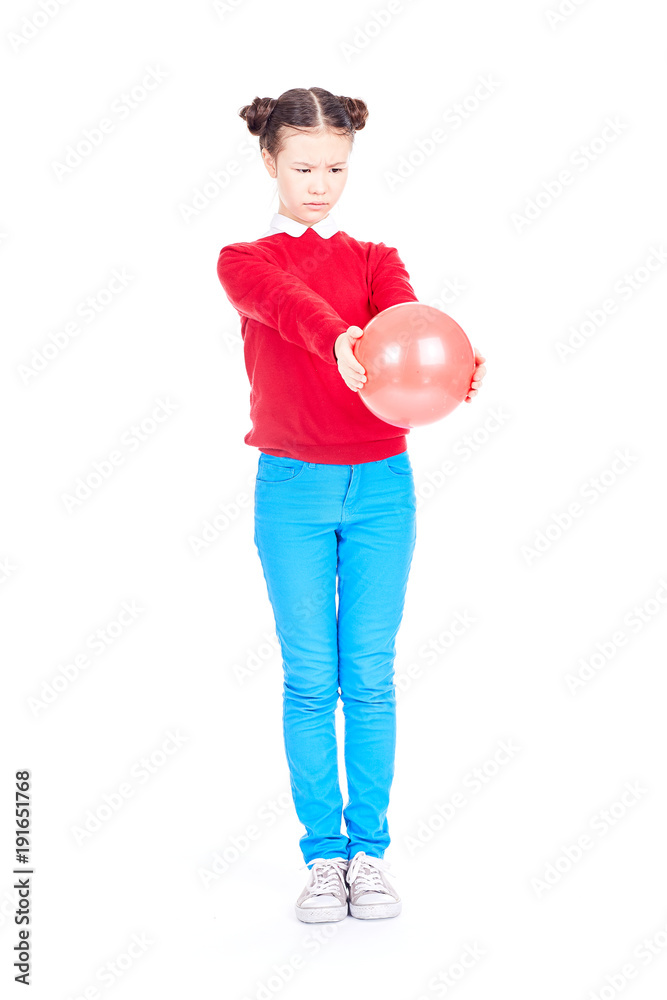 Portrait of playful girl posing with gymnastic ball on white background Portrait of playful girl posing with gymnastic ball on white background