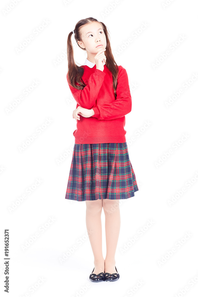 Asian female elementary student in school uniform posing on white background Asian female elementary student in school uniform posing on white background