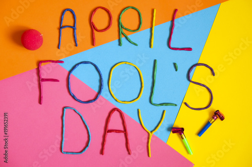 Funny font first april fools day written in plastecine of different colors. photo