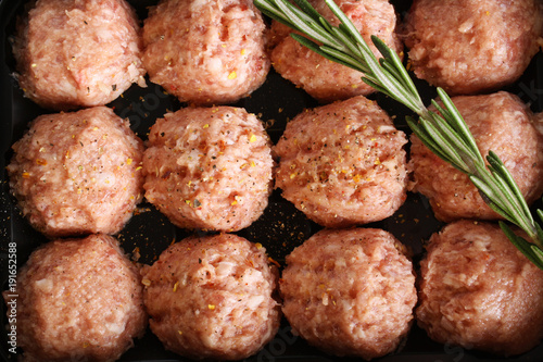 meatball forcemeat beef pork on wooden background rosemary