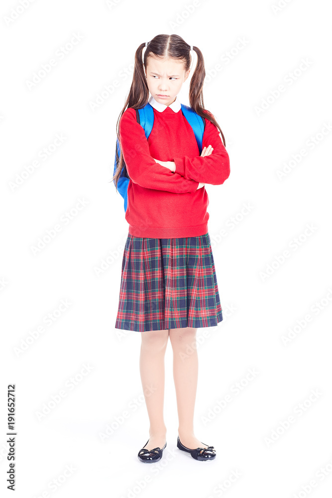 Asian female elementary student in school uniform posing on white background Asian female elementary student in school uniform posing on white background